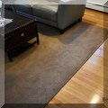 DR02. Brown living room rug. Measures approx. 11'6" x 11'10" 